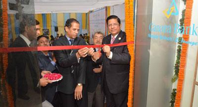 Chairman and Managing Director of Canara Bank, Mr R K Dubey, inaugurating a new branch at Nangloi in New Delhi. He is flanked by Mr V S Krishna Kumar and Mr P S Rawat, Executive Directors of the Bank