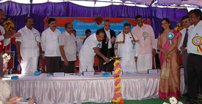 Union Minister Dr M Veerappa Moily lighting the Lamp, flanked by Union Minister K H Muniyappa alongwith Mr S Raman, Chairman & Managing Director of Canara Bank