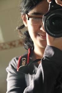 A young child experiencing Canon 60D, the latest DSLR from the company