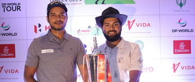 (From left to right): Golfers Manu Gandas and Aman Raj with the Hero Indian Open trophy