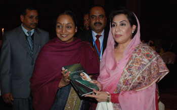 Lok Sabha Speaker Meira Kumar receiving a copy of a book on late Benazir Bhutto from the Speaker of the National Assembly of Pakistan Dr Fehmida Mirza on January 5, 2010