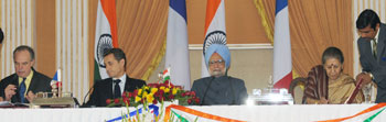 The Minister of Culture and Communication, France, Mr. Frederic Mitterrand and the Union Minister for Information and Broadcasting, Mrs Ambika Soni signing the agreement on Film Co-Production between India and France, in the presence of the Prime Minister, Dr. Manmohan Singh and the President of France, Mr. Nicolas Sarkozy, in New Delhi on December 6, 2010.
