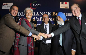 French Minister of Economy and Finance Christine Lagarde (second from left) and Deputy Chairman of Planning Commission Montek Singh Ahluwalia (second from right) with (from left) FICCI President Rajan Bharti Mittal, FICCI Secretary General Amit Mitra and Honorary President of Lafarge and Co-chair of the Indo-French CEO's Forum Bertrand Collomb, at a meeting in New Delhi on Monday.