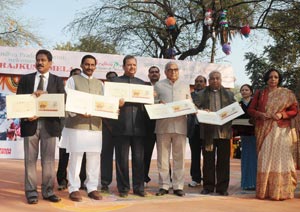 Union Minister for Tourism Subodh Kant Sahai releasing a postal stamp at the inauguration of the 25th Surajkund Crafts Mela, in Surajkund, Haryana on February 01, 2011. Chief Minister of Haryana Bhupinder Singh Hooda and Chief Minister of Andhra Pradesh N. Kiran Kumar Reddy are also seen.